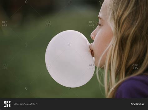 girl blowing  bubble  chewing gum stock photo offset