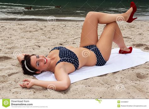 sexy laughing woman sunbathing in high heels royalty free