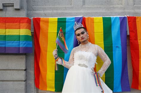 a participant wearing wedding dress takes part in a lesbian gay