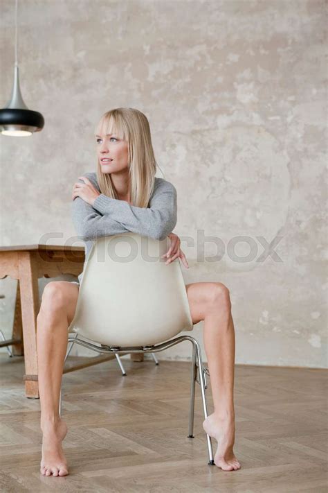 Woman Sitting On Chair With Naked Legs Stock Image Colourbox