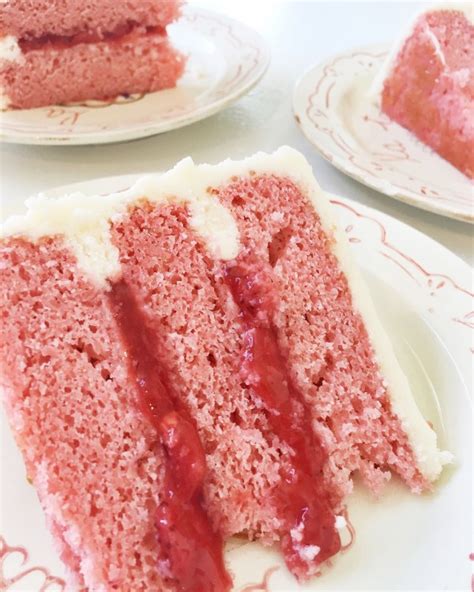 strawberry cake with fresh strawberry filling and cream cheese frosting