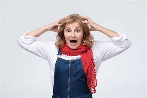 Premium Photo Extremely Amazed Cheerful Mature Woman Is Surprised