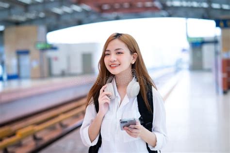 Young Asian Girl Waiting For The Train At The Station Stock Image
