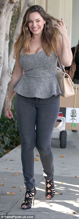 newly single kelly brook squeezes ample assets in tight peplum top as