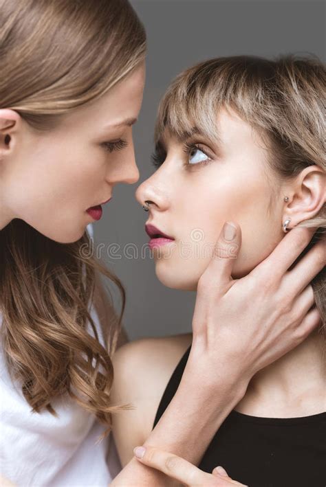 sensual lesbian couple emracing and looking on eath other