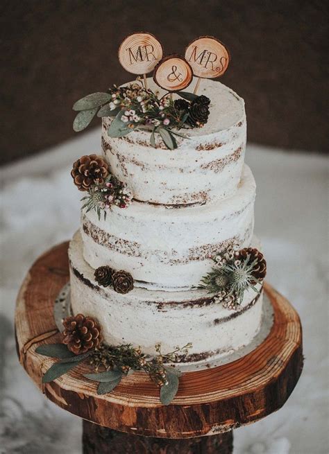 rustic wedding cake on slice of wood naked wedding cake