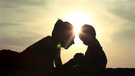 silhouette of mother and daughter over sunset stock footage video 3149488 shutterstock