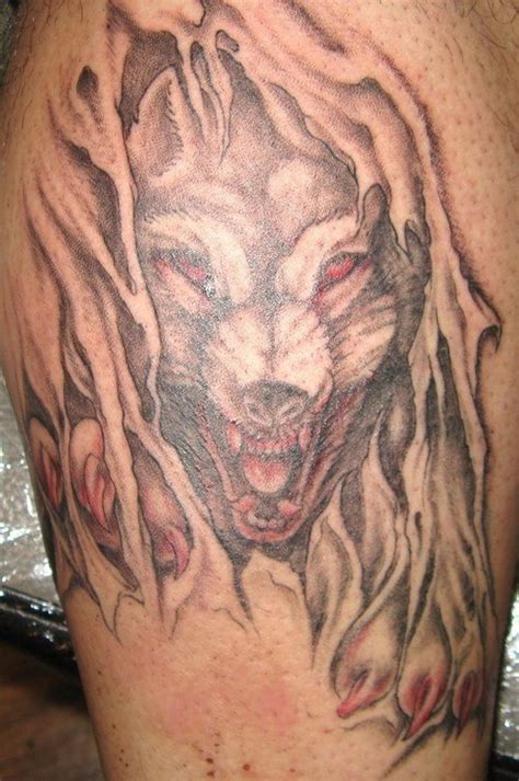 Angry Wolf Tearing Skin Tattoo Tattooimages Biz