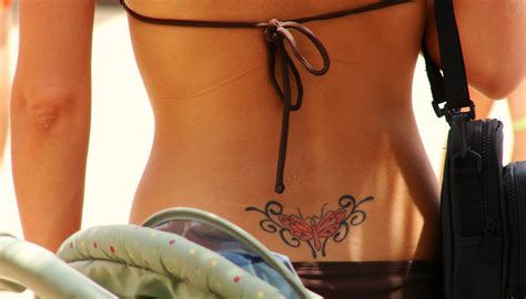 Female Hip Bone Tattoos Tribal Flower Tail Bone Tattoo Lower Back