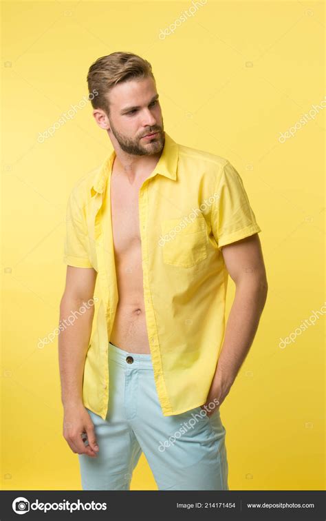 man calm face posing confidently yellow background guy wear unbuttoned