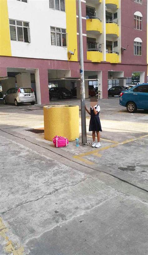 cruel mum ties daughter to lampost with a chain as punishment for