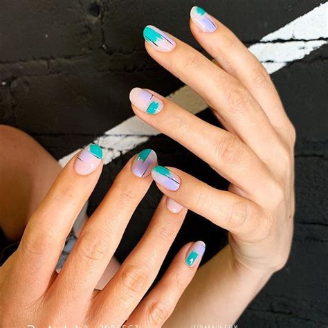 womans hands  blue  green nail polish