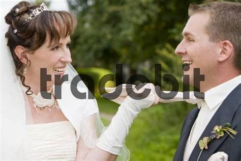 laughing bride pulling grooms tie download people