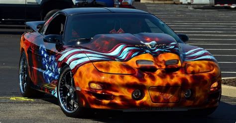 american sports cars ruined  hideous paint jobs hotcars