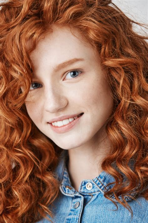 Close Up Of Redhead Beautiful Girl With Freckles Smiling