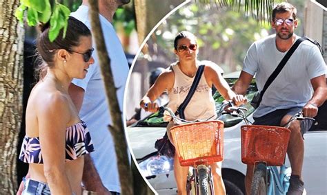 danica patrick and aaron rodgers hold hands in mexico