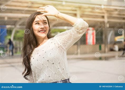 beautiful girl covering face  hand  sunlight stock photo image  people