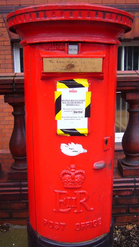 red post box  royal british icon  lady  waiting
