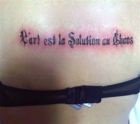 Frances Bean Cobain French Writing Upper Back Tattoo
