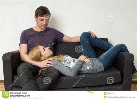 A Young Couple Resting On The Couch Stock Image Image Of Affection