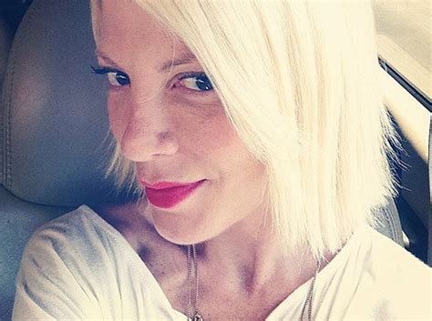 tori spelling chops off her own hair see short new do