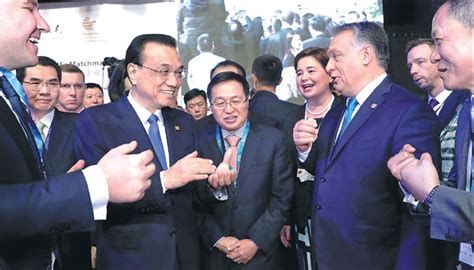 premier li keqiang and hungarian prime minister viktor orban talk with entrepreneurs after the