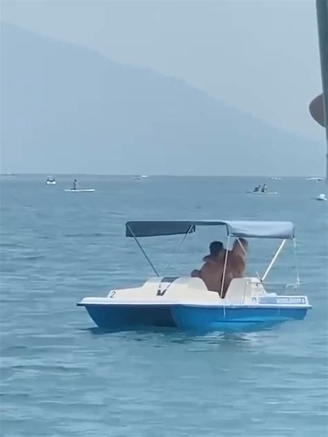Watch Shocking Moment Couple Are Caught Romping On Pedalo Just Yards
