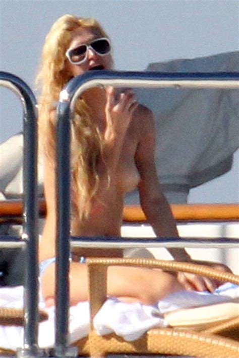paris hilton exposing her nice tits while sunbathing topless on yacht