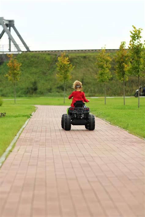 girl riding big toy car in park stock image image of lane candid