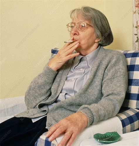 elderly woman smoking a cigarette stock image m370 0442 science
