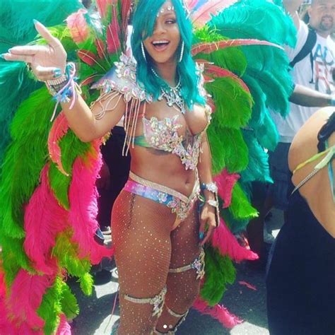 island gyal rihanna looks at a carnival in barbados with blue hair