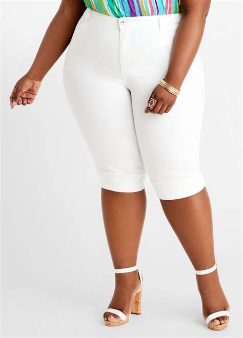 complete with a wide roll cuff these plus size denim capris will skim