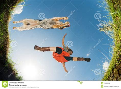jumping   creek stock photo image  meadow person