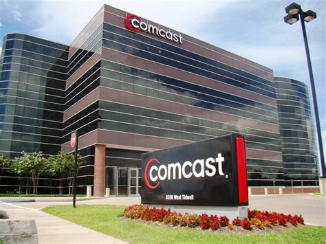 comcast accuses merger opponents  extortion broadband tv news