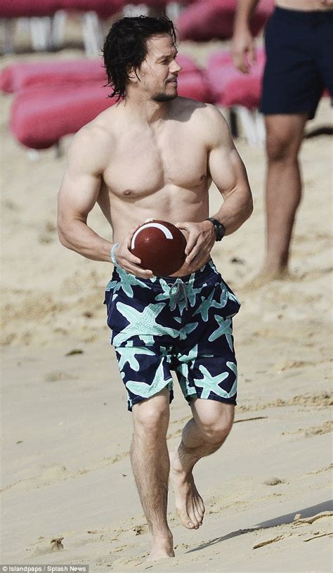 mark wahlberg keeps wife rhea durham entertained as he plays beach football daily mail online