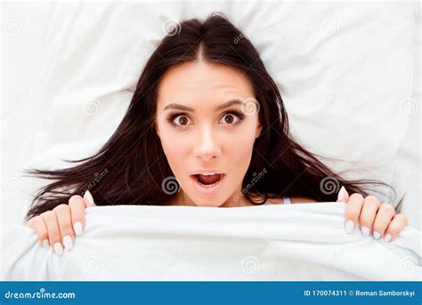 Top View Portrait Of Shocked Woman With Open Mouth After Sleep Stock