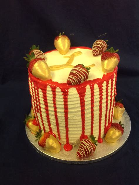frosted drip cake with strawberries dipped in gold strawberry cakes