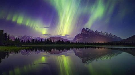 aurora borealis mountains lake reflection banff national park
