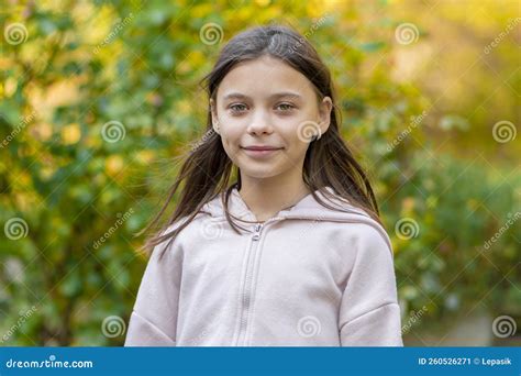 Street Portrait Of A Beautiful Girl 10 12 Years Old With Long Hair In