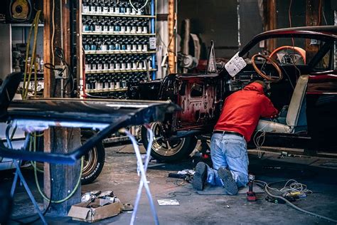 mechanic fixing car  garage adult auto automobile repair shop