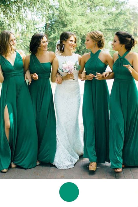 A Group Of Women Standing Next To Each Other Wearing Green Bridesmaid Gowns