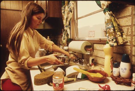 housewife in the kitchen of her mobile home in one of the