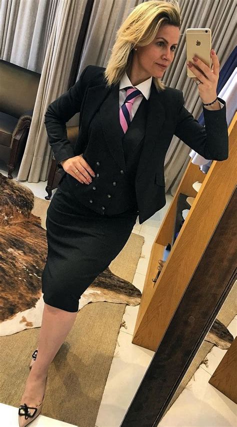 dressed in new skirt suit with shirt and tie women