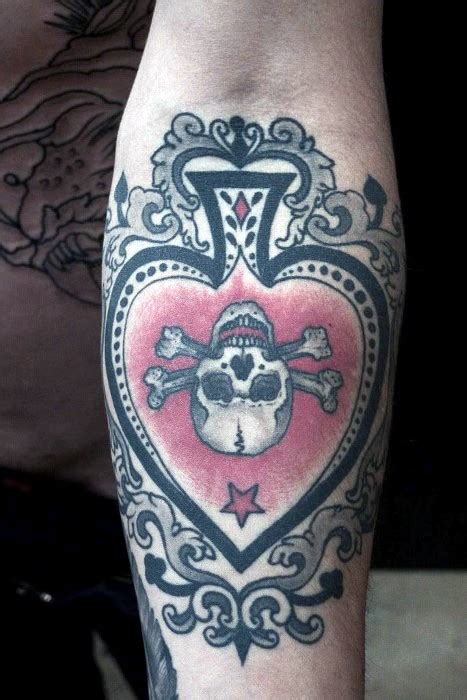 beautiful designed big colored spades with skull tattoo on arm