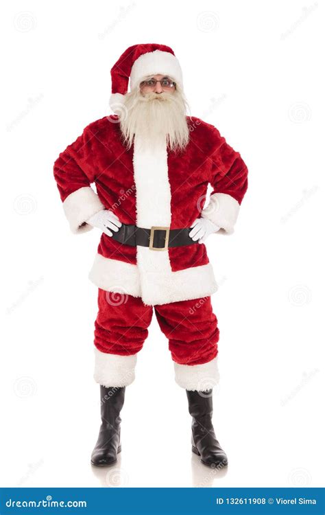 merry santa claus stands  holding  hips stock photo image