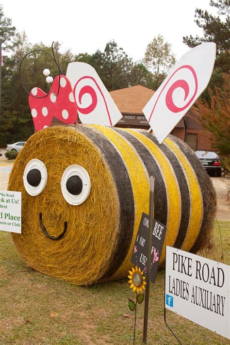 large hay bale   smiling bee   face   signs  front