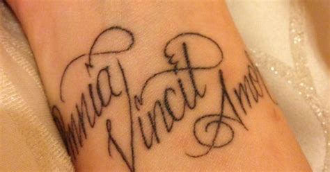omnia vincit amor wrist tattoo love conquers all in latin body art pinterest wrist