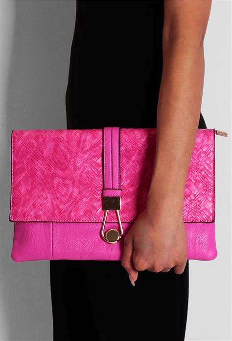 fab   pink clutch accessorizing   bright colour   great   add  pop