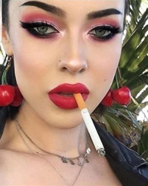 pin on red lips and smoking