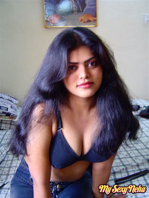 wonderful looking busty indian babe neha shows her big boobs by stripping her bra asian porn